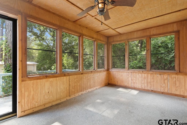 1656 Pineview Ln, Hideaway, TX 75771 - unfurnished sunroom with plenty of natural light, wooden walls, and carpet