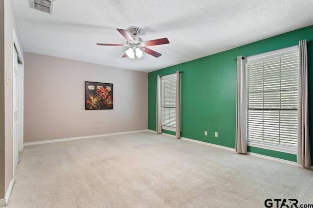 1656 Pineview Ln, Hideaway, TX 75771 - unfurnished bedroom with carpet floors, a textured ceiling, and ceiling fan