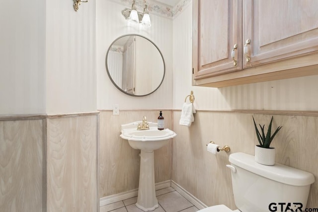 1656 Pineview Ln, Hideaway, TX 75771 - half bath with tile patterned flooring and a wainscoted wall