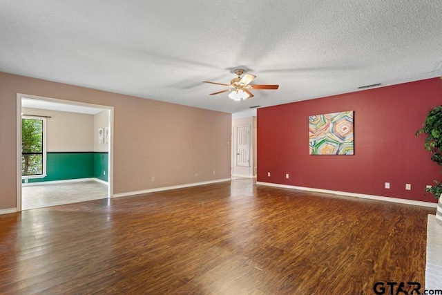 1656 Pineview Ln, Hideaway, TX 75771 - unfurnished room with a ceiling fan, wood finished floors, and a textured ceiling