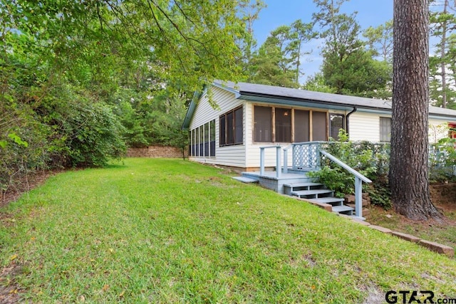 1656 Pineview Ln, Hideaway, TX 75771 - view of front of home featuring a sunroom and a front lawn