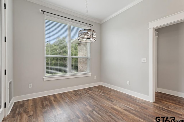 228 Smith Cir, Lindale, TX 75771 - unfurnished dining area with a chandelier, healthy amount of natural light, ornamental molding, and dark wood-type flooring