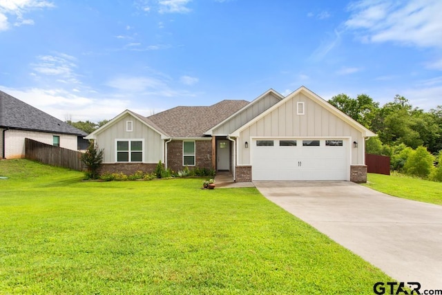 228 Smith Cir, Lindale, TX 75771 - view of front of property with board and batten siding, concrete driveway, an attached garage, and brick siding
