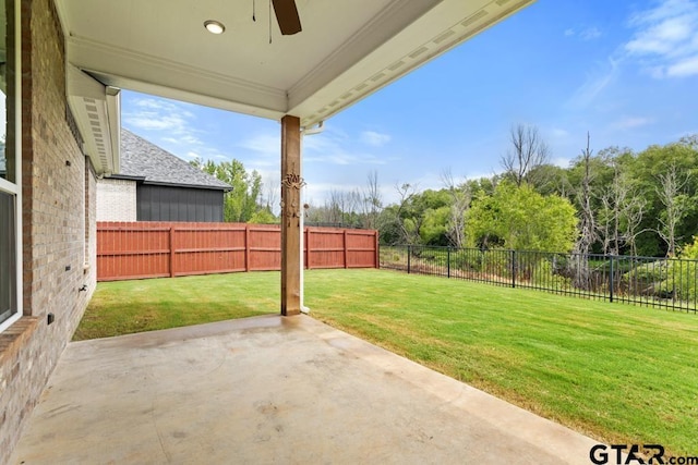 228 Smith Cir, Lindale, TX 75771 - fenced backyard with ceiling fan and a patio