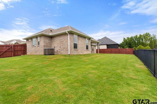 228 Smith Cir, Lindale, TX 75771 - rear view of property with a fenced backyard and brick siding