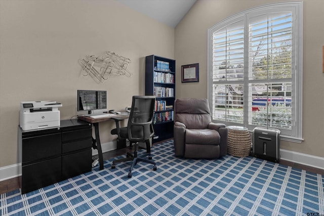 office space with hardwood / wood-style floors and lofted ceiling