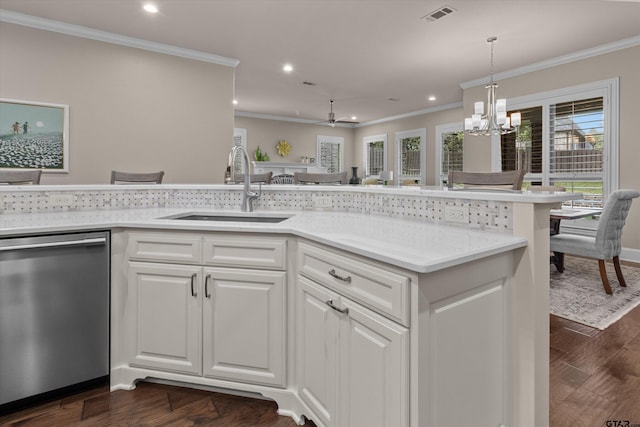 kitchen with dishwasher, white cabinets, ceiling fan with notable chandelier, crown molding, and sink