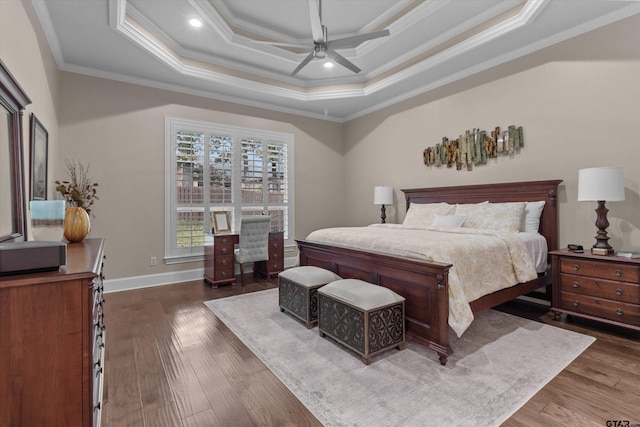 bedroom featuring dark hardwood / wood-style flooring, ceiling fan, and ornamental molding