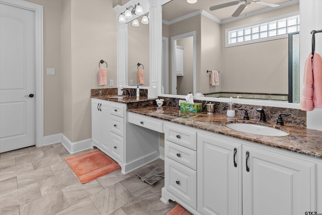 bathroom featuring ceiling fan, crown molding, and vanity