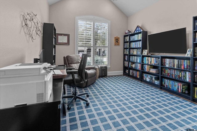 home office with lofted ceiling