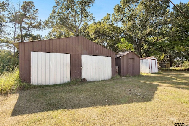 garage featuring a yard