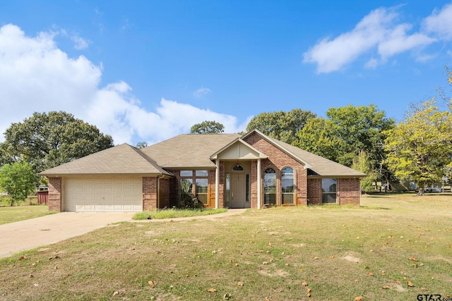 ranch-style house featuring a garage and a front yard