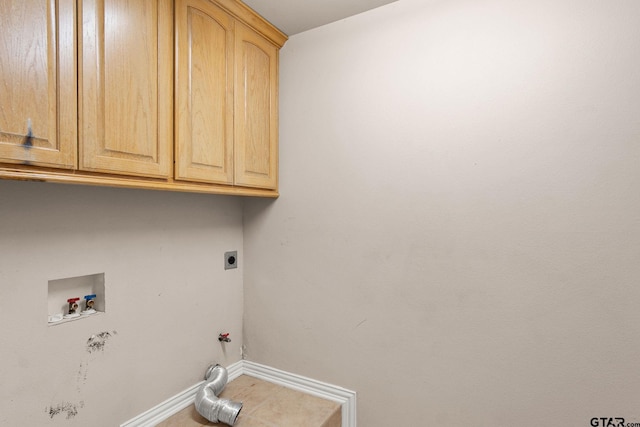 clothes washing area featuring cabinets, washer hookup, gas dryer hookup, and electric dryer hookup