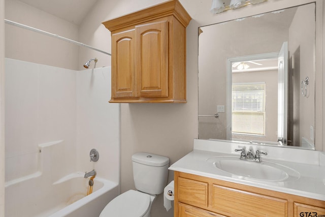 full bathroom featuring shower / tub combination, vanity, toilet, and vaulted ceiling