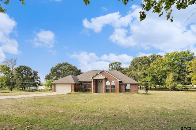 single story home with a front lawn and a garage