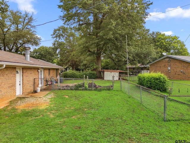616 Golfcrest Dr, Longview, TX 75604 - fenced backyard with a storage unit