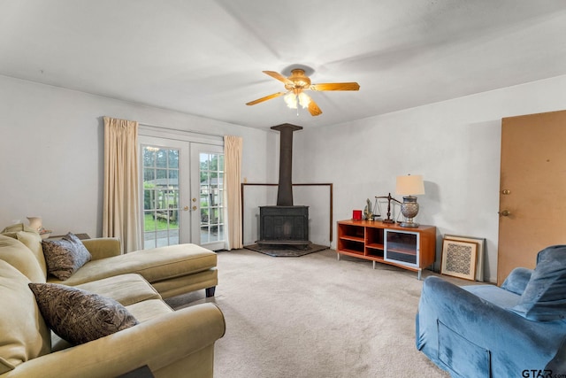 616 Golfcrest Dr, Longview, TX 75604 - living area with french doors, a wood stove, carpet flooring, and ceiling fan