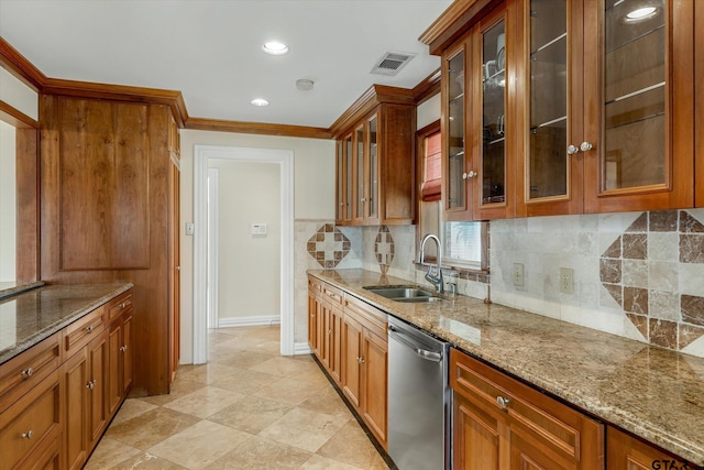 kitchen featuring dishwasher, sink, light stone counters, and ornamental molding