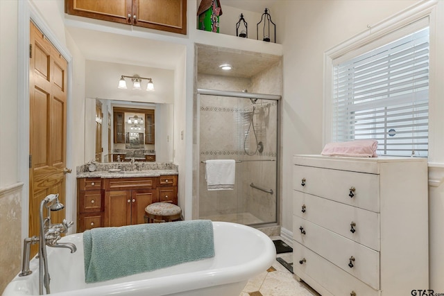 bathroom featuring tile patterned flooring, vanity, and separate shower and tub