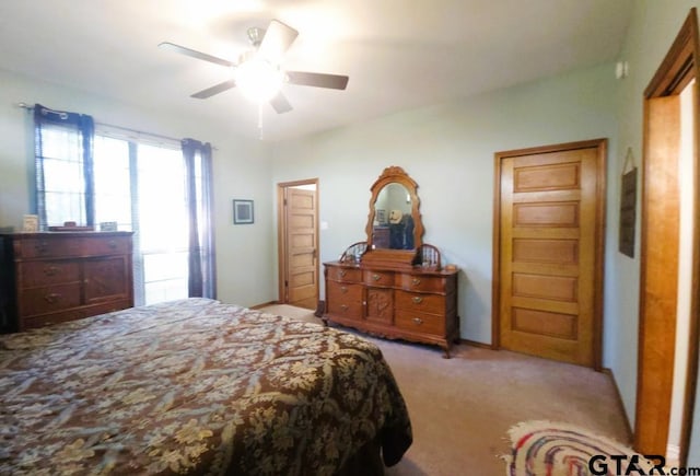 bedroom with ceiling fan and carpet floors