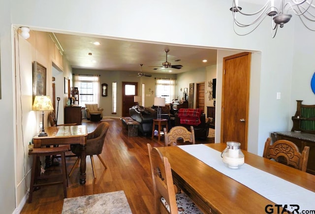 dining room with a wealth of natural light, wood finished floors, and ceiling fan