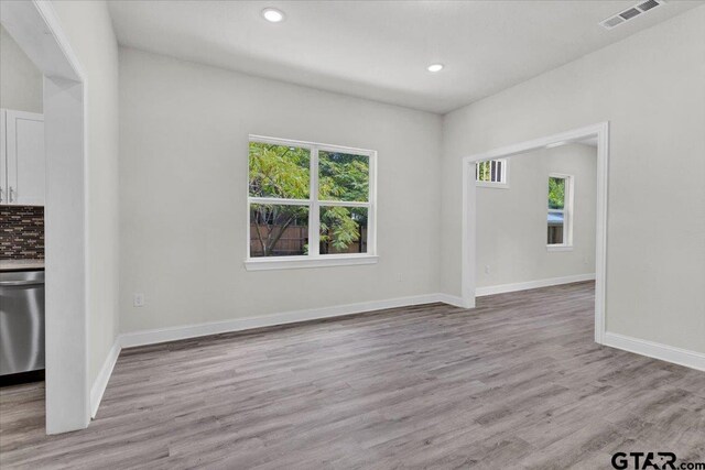 254 SE 19th St, Paris, TX 75460 - unfurnished living room with plenty of natural light, light wood-style floors, recessed lighting, and baseboards