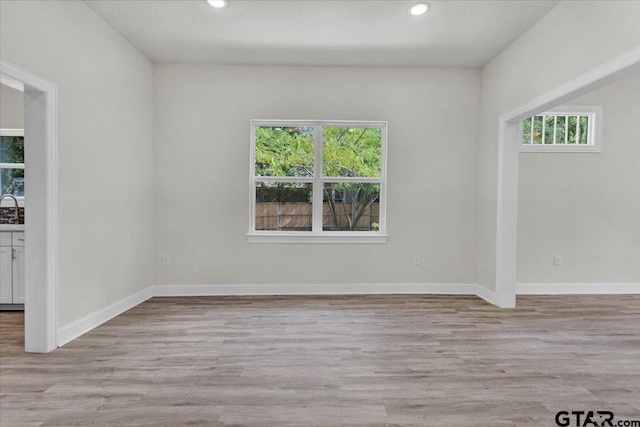 254 SE 19th St, Paris, TX 75460 - unfurnished room featuring recessed lighting, wood finished floors, baseboards, and a sink