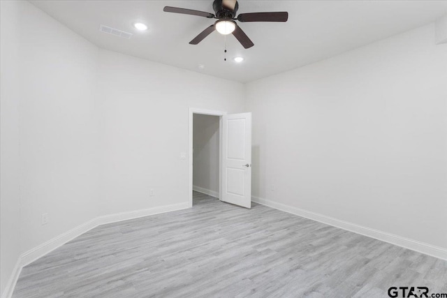 unfurnished room featuring light hardwood / wood-style floors and ceiling fan