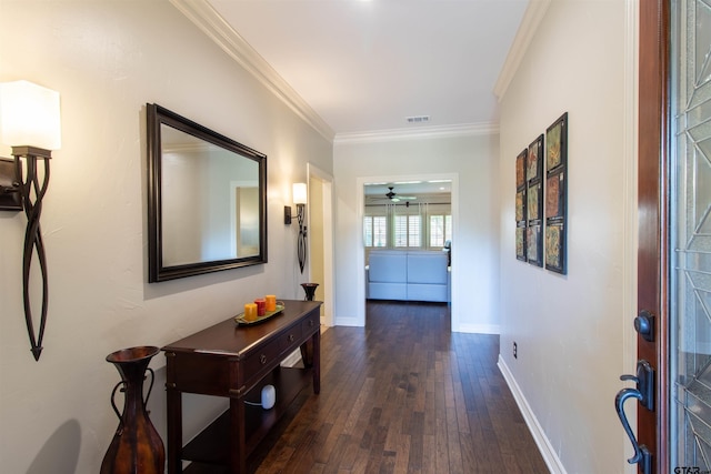 corridor featuring dark hardwood / wood-style flooring and ornamental molding