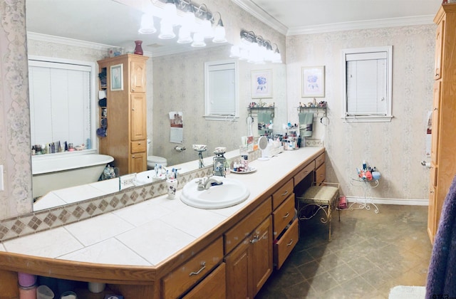 bathroom featuring vanity, toilet, and ornamental molding