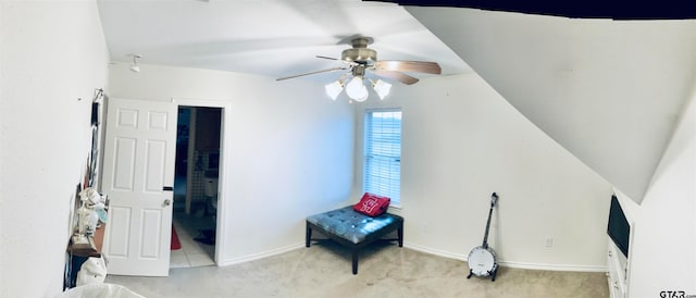 interior space with ensuite bathroom and ceiling fan