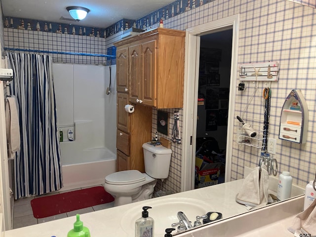 full bathroom featuring shower / tub combo, toilet, tile patterned floors, and sink