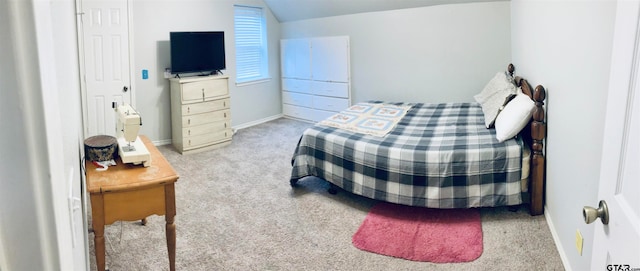 bedroom featuring light colored carpet