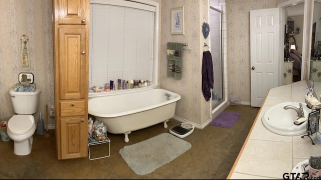 full bathroom with tile patterned floors, toilet, sink, and independent shower and bath