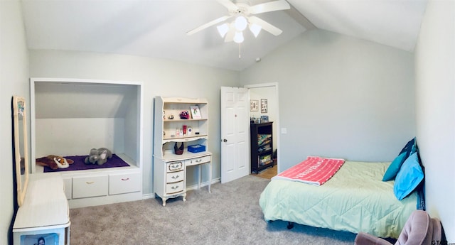 bedroom with light colored carpet, vaulted ceiling, and ceiling fan