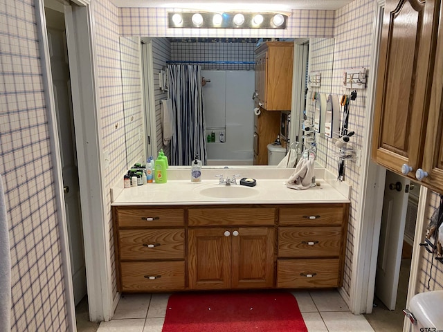 bathroom with tile patterned floors, vanity, and toilet