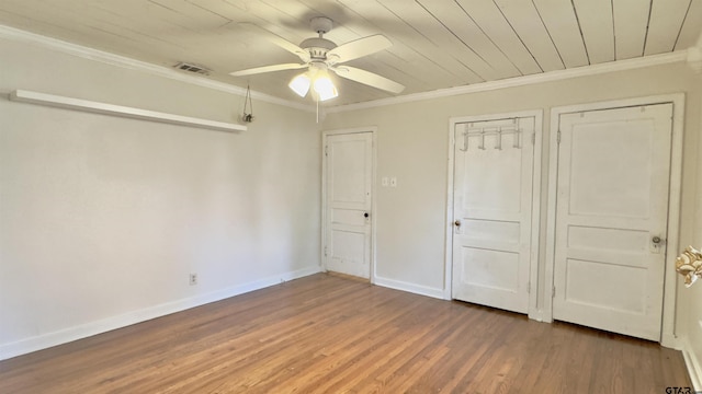 1012 W 8th St, Tyler, TX 75701 - unfurnished bedroom featuring wood finished floors, crown molding, baseboards, wood ceiling, and ceiling fan