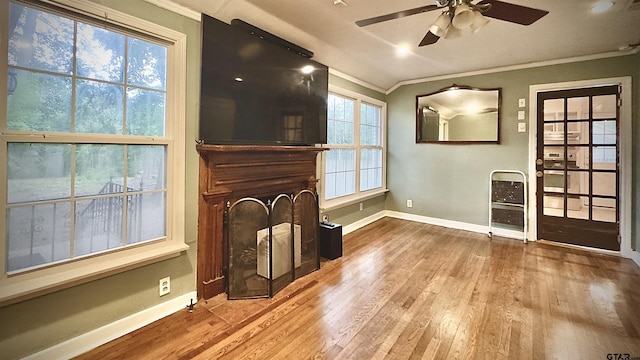 1012 W 8th St, Tyler, TX 75701 - unfurnished living room with crown molding, baseboards, wood finished floors, ceiling fan, and heating unit