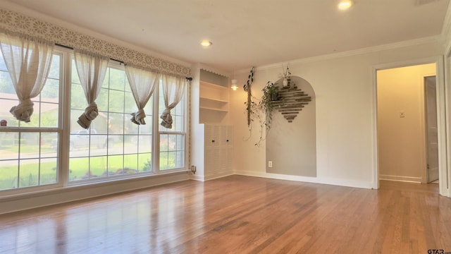 1012 W 8th St, Tyler, TX 75701 - unfurnished room featuring baseboards, wood finished floors, ornamental molding, and recessed lighting