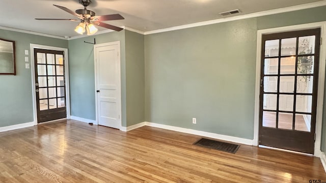 1012 W 8th St, Tyler, TX 75701 - unfurnished room with wood finished floors, a ceiling fan, baseboards, and ornamental molding