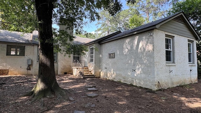 1012 W 8th St, Tyler, TX 75701 - rear view of property featuring brick siding