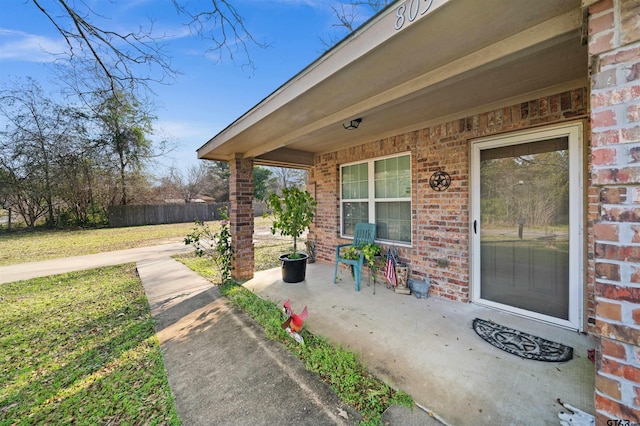 doorway to property with a yard