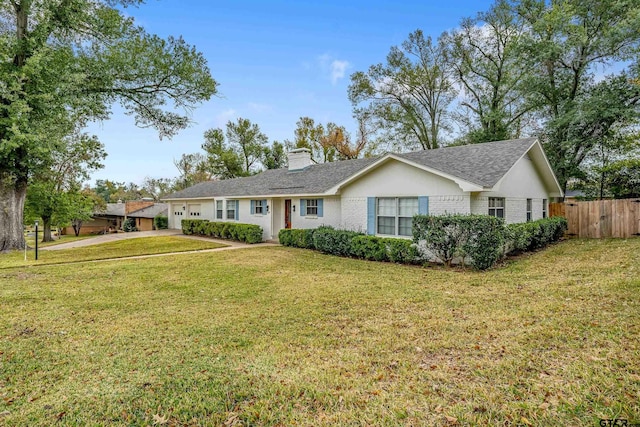 ranch-style home with a front lawn