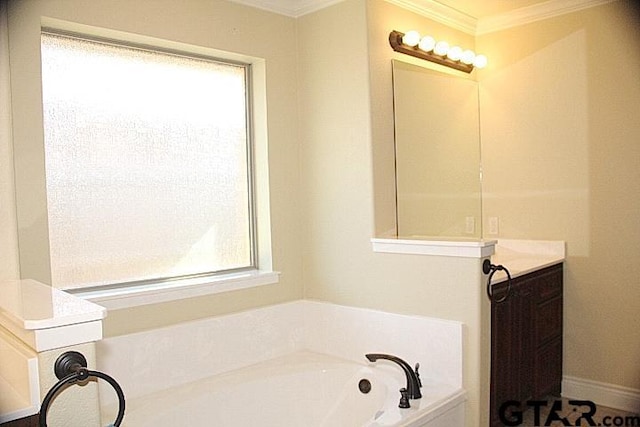 full bathroom featuring ornamental molding, a garden tub, and baseboards