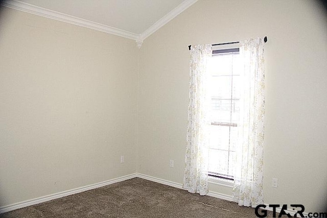 unfurnished room featuring crown molding, dark colored carpet, vaulted ceiling, and baseboards