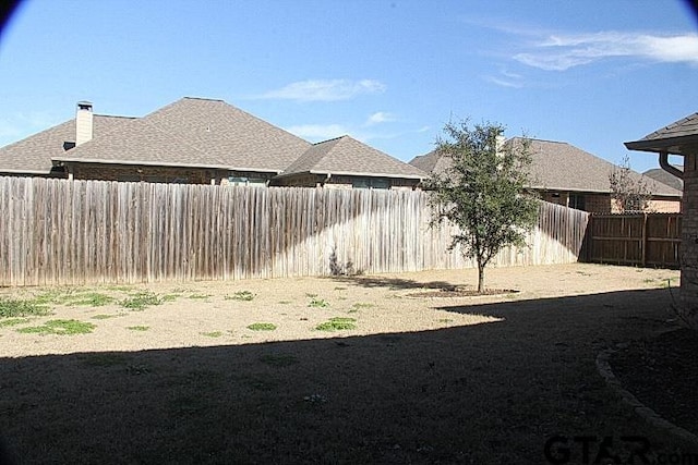 view of yard featuring a fenced backyard