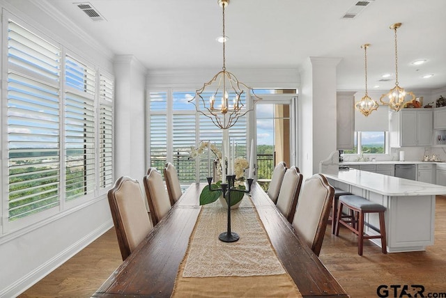 2801 Wexford Dr, Tyler, TX 75709 - dining space with a chandelier, healthy amount of natural light, wood finished floors, ornamental molding, and recessed lighting