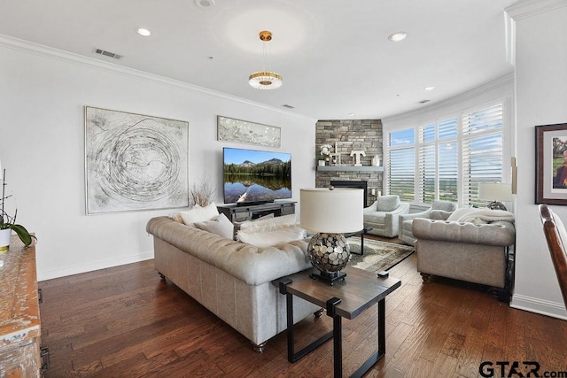2801 Wexford Dr, Tyler, TX 75709 - living area featuring crown molding, dark wood-style floors, a stone fireplace, and recessed lighting
