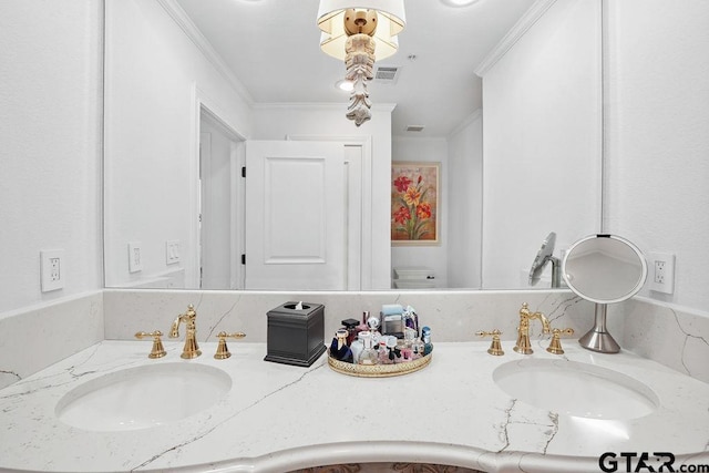 2801 Wexford Dr, Tyler, TX 75709 - bathroom with double vanity and ornamental molding