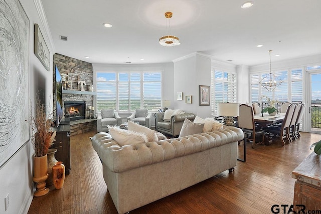 2801 Wexford Dr, Tyler, TX 75709 - living room featuring hardwood / wood-style floors, recessed lighting, a chandelier, crown molding, and plenty of natural light